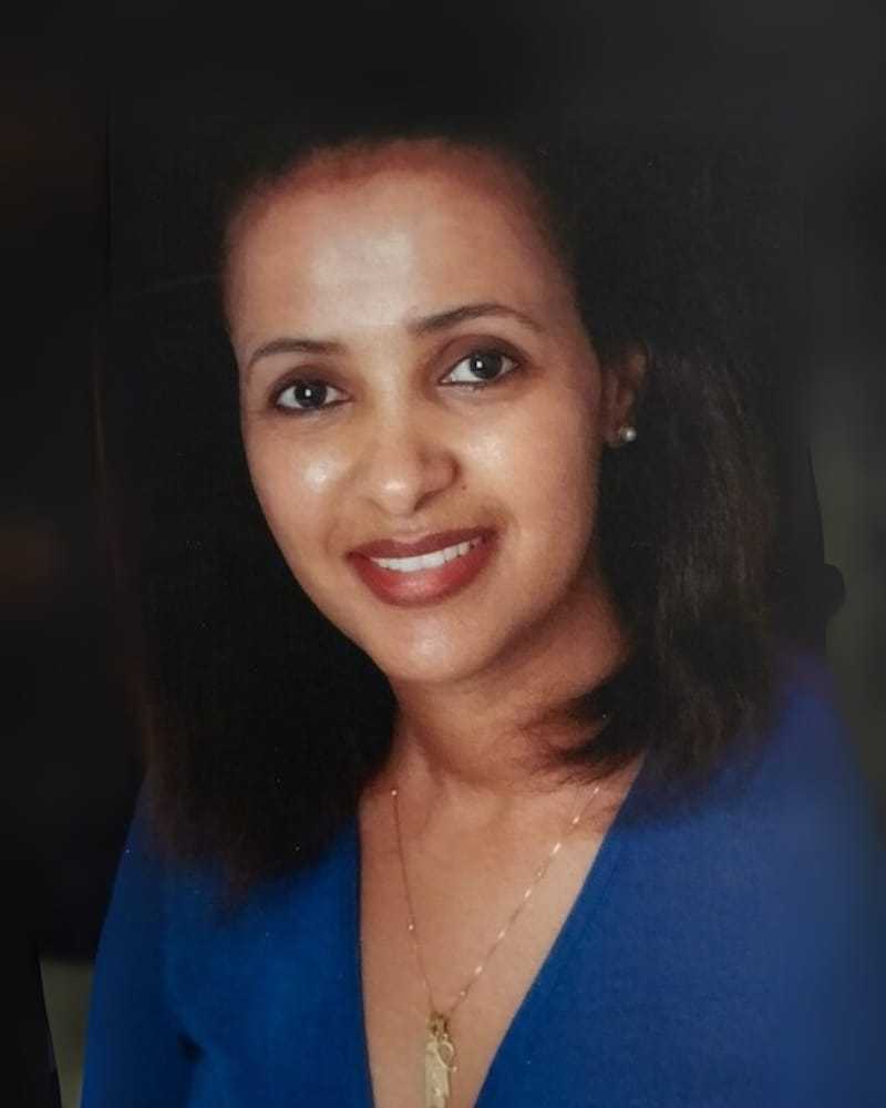 Portrait of Zewdi Bahbla, a professional stylist at Cole Stevens Salon, showcasing their expertise and style.