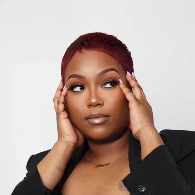 Portrait of Paris Butler, a professional stylist at Cole Stevens Salon, showcasing their expertise and style.