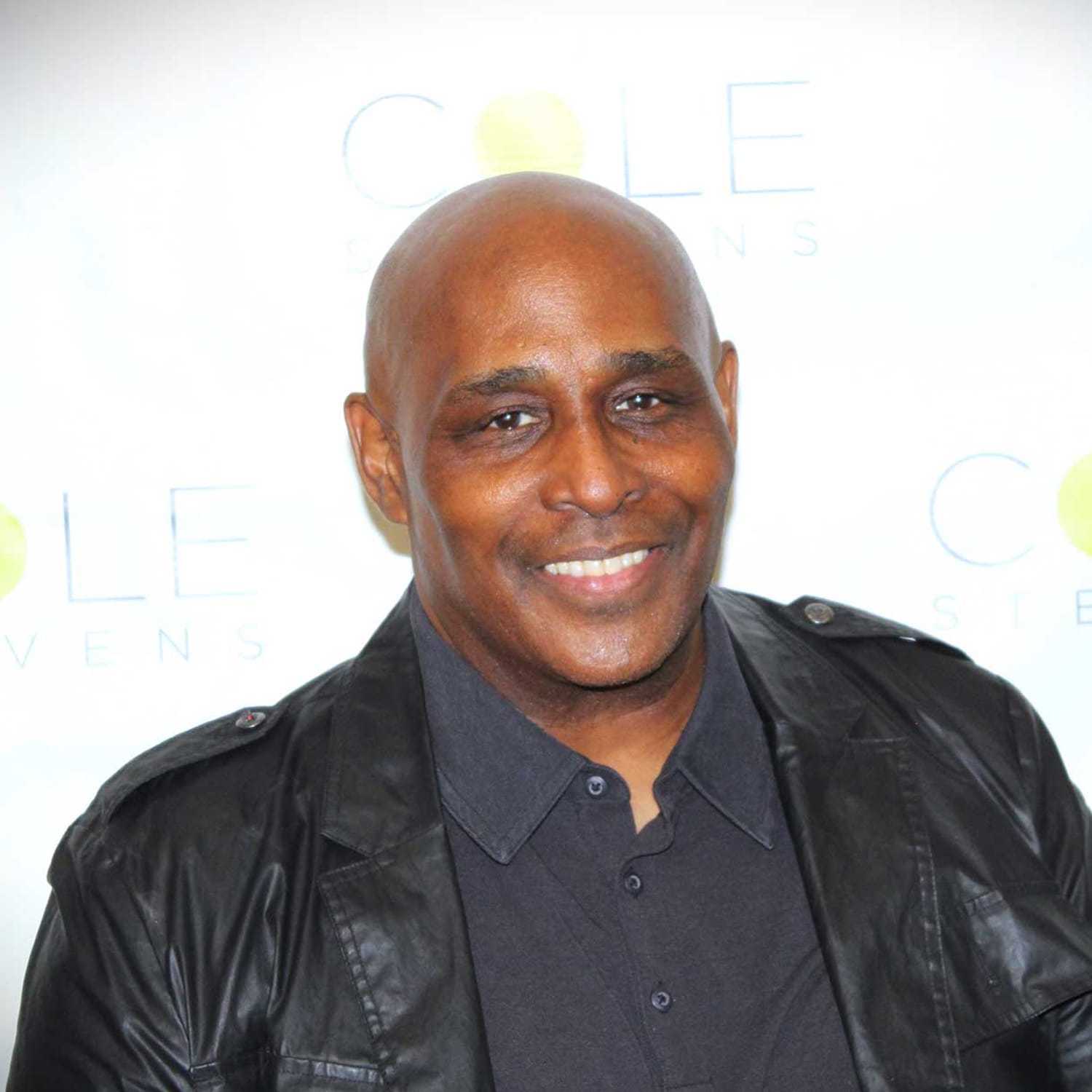 Portrait of Jamel Monroe, a professional stylist at Cole Stevens Salon, showcasing their expertise and style.